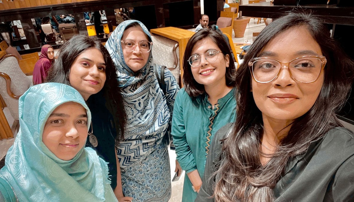 Faiza Yousuf (centre) with the CaterpillHERs team. — Photo by author