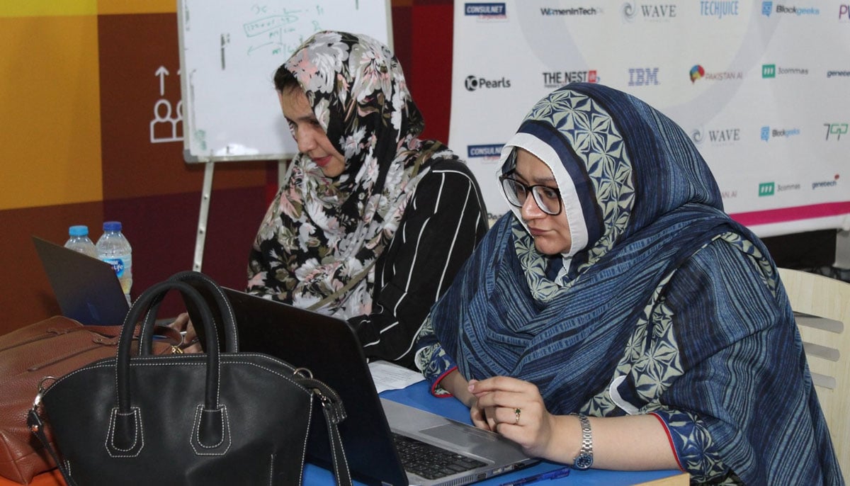 Shamim Razani (left) and Faiza Yusuf at CryptoChix's Hackathon, 2019.  — Author's photo