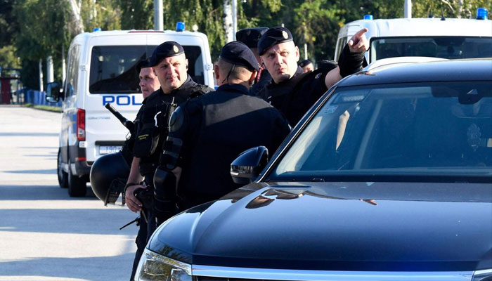 Greek police officers at a crime scene in Athens. —AFP/file