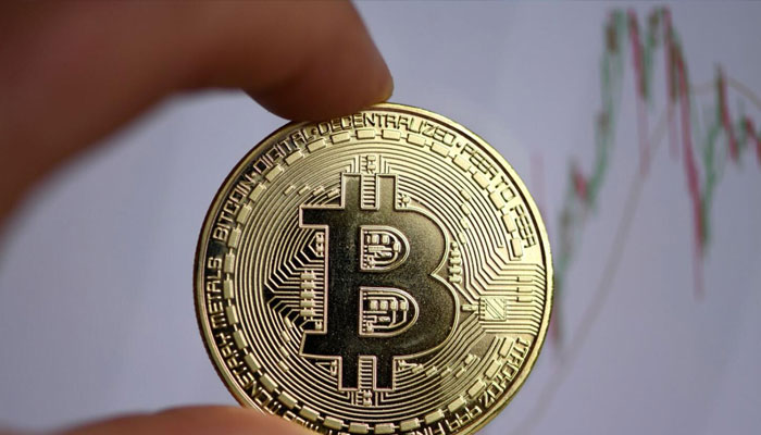 The photo shows a physical imitation of a Bitcoin in Dortmund, western Germany. — AFP file