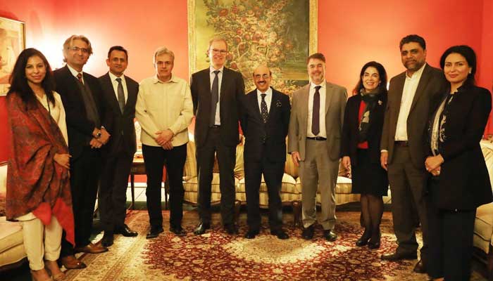 Pakistans Ambassador Masood Khan (centre) along with officials of IFIs