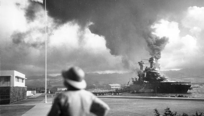 The damaged battleship USS California, listing to port after being hit by Japanese aerial torpedoes and bombs, is seen off Ford Island during the attack.—Reuters