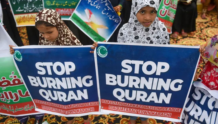 Activists take part in a demonstration in Karachi on July 9, 2023, as they protest against the burning of the Quran outside a Stockholm mosque that outraged Muslims around the world. —AFP