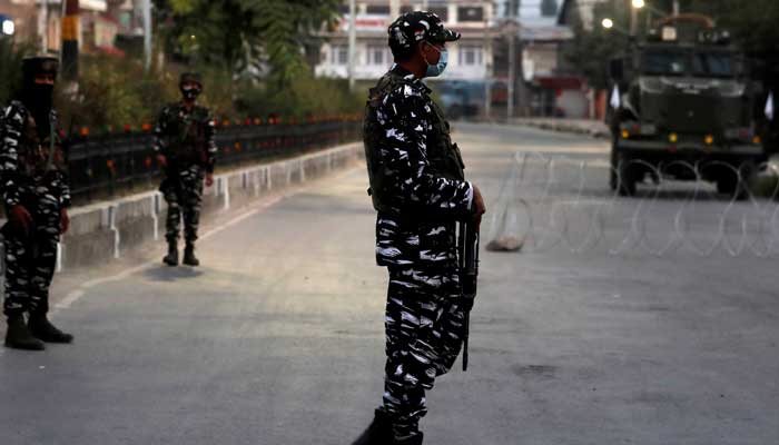 Indian security force personnel stand guard near the residence of Syed Ali Shah Geelani, a veteran separatist politician from IIOJK after he died in Srinagar, on September 2, 2021. — Reuters