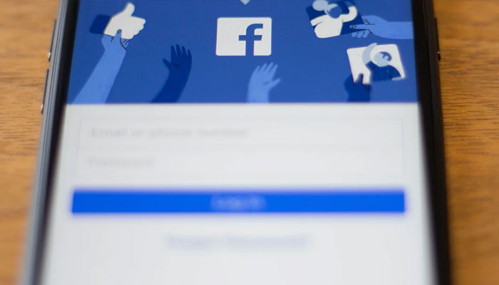The Facebook logo is seen on a phone in this photo illustration in Washington, DC, on July 10, 2019.—AFP