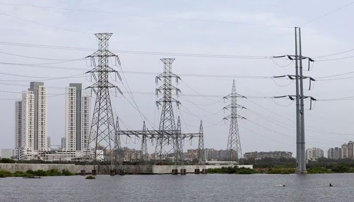 Power transmission towers are pictured in Karachi, Pakistan July 26, 2022. — Reuters