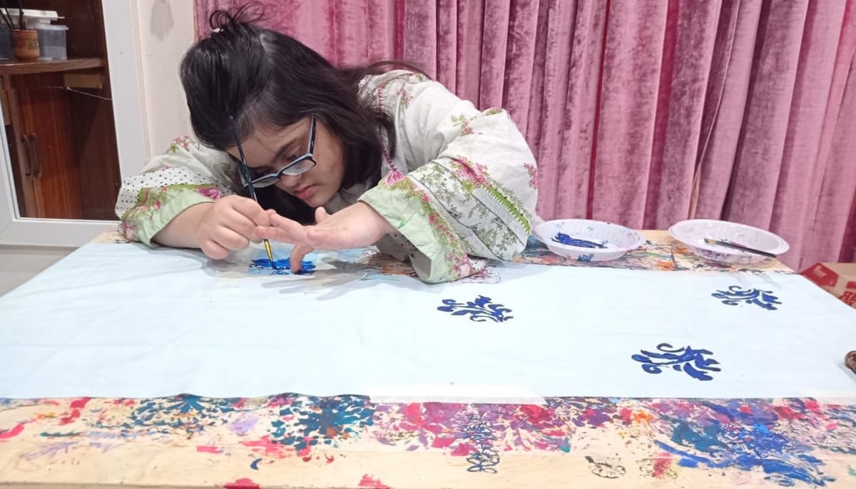Najla does block printing on a fabric. — Photo by Dr Sajeela Haroon