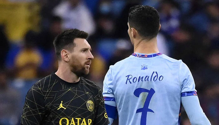 Former Paris Saint-Germain´s Argentine forward Lionel Messi (left) walks past Riyadh All-Star´s Portuguese forward Cristiano Ronaldo during the Riyadh Season Cup football match between the Riyadh All-Stars and Paris Saint-Germain at the King Fahd Stadium in Riyadh on January 19, 2023. — AFP