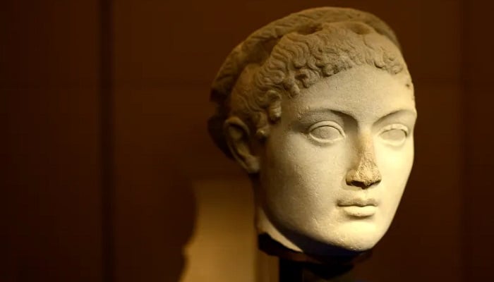 The head of a statue depicting Cleopatra, the last active pharaoh of ancient Egypt, is displayed as part of an exhibition entitled The Myth of Cleopatra on April 9, 2014, at the Pinacotheque in Paris.— AFP