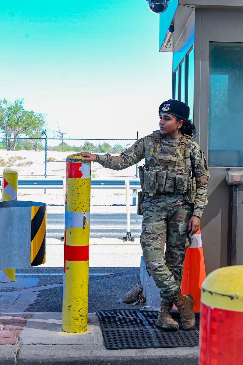 Airman 1st Class Hamna Zafar, 377th Security Forces Squadron Airman, checks visitor identification at Kirtland Air Force Base, NM, Aug. 17, 2023. As a security forces Airman, Zafar is tasked with installation patrol, installation access control and base defence alarm monitoring. — US Air Force photo by Senior Airman Karissa Dick