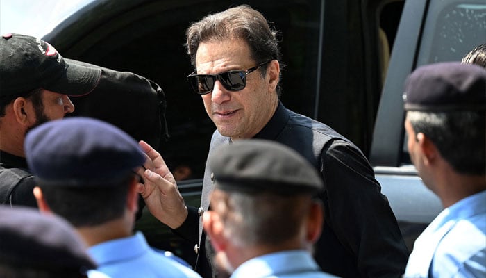 Pakistans former Prime Minister Imran Khan (C) arrives to appear in the Supreme Court in Islamabad on July 24, 2023. — AFP