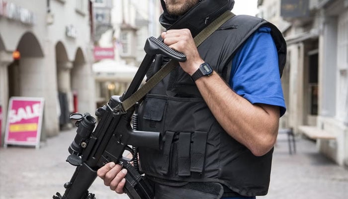 Armed police in the old town of Schaffhausen as officers search for the attacker. — EPA