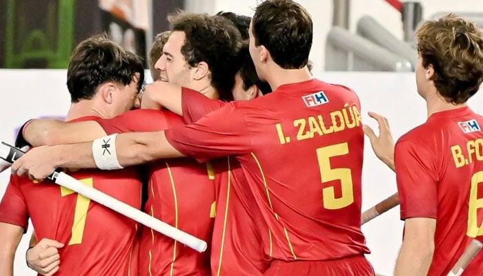 Spanish hockey team players celebrate during the quarter-final match with Pakistan. — X/@rfe_hockey