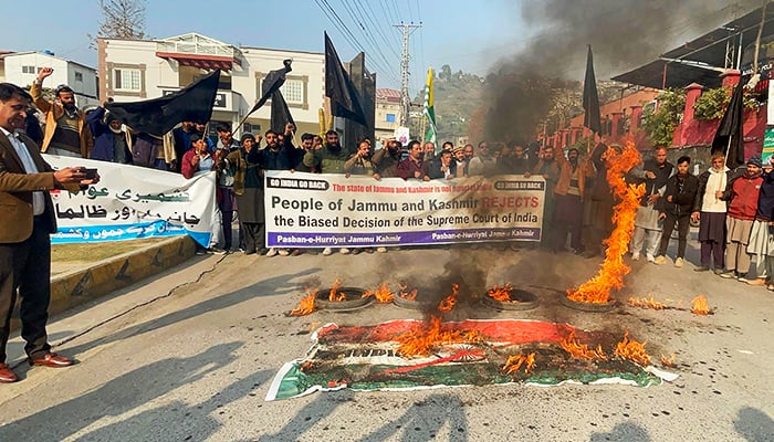 Pasban-e-Hurriyat Jammu and Kashmir activists shout slogans at Muzaffarabad, on December 11, 2023, as they protest against Indias Supreme Court upholding the abrogation of Article 370 of the Constitution that repeals the special status of Kashmir. — AFP