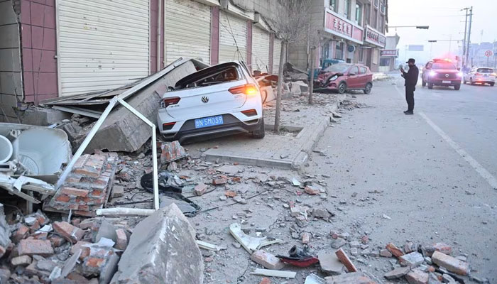Damaged cars are seen amid rubble next to damaged buildings at Dahejia town following the earthquake in Jishishan county, Gansu province, China December 19, 2023. — Reuters