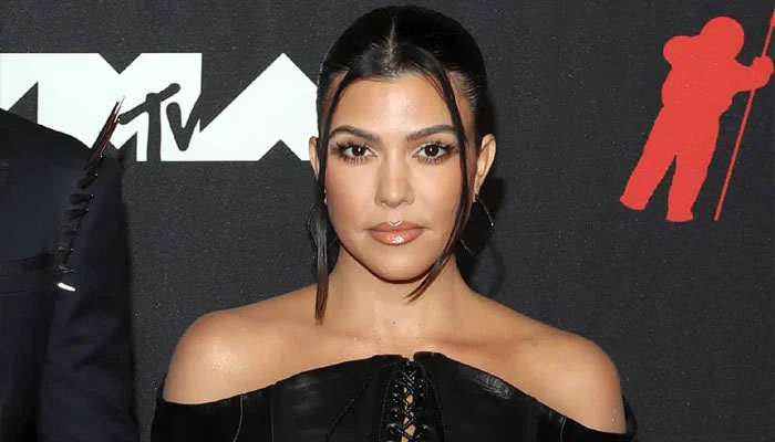 Kourtney Kardashians mansions kitchen can be seen littered with clothes in a new video shared by her step daughter