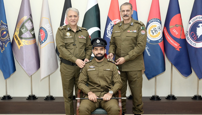 Pakistan’s all-rounder Shadab Khan (centre) during a ceremony for appointing him as Punjab Polices brand ambassador, on December 20, 2023. — X/@OfficialDPRPP
