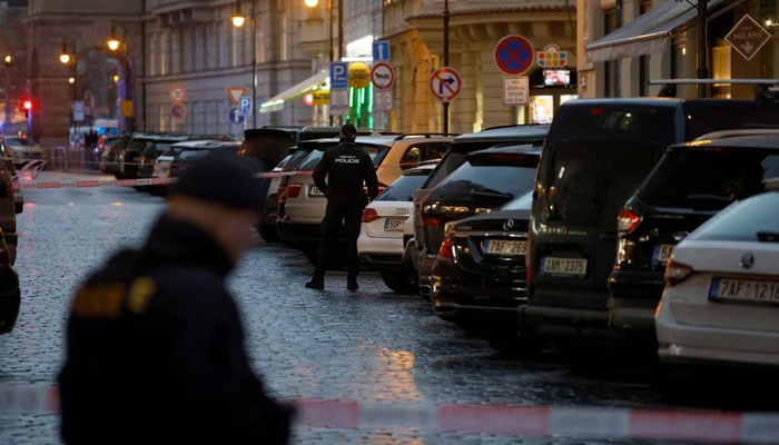 Police officers secure the area following the shooting at one of the buildings of Charles University in Prague, Czech Republic, December 21, 2023. —Reuters