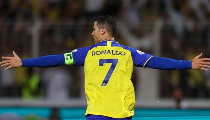 Al Nassr’s Portuguese forward Cristiano Ronaldo celebrates scoring his team’s fourth goal in the Saudi Pro League game against AlWehda at Saudi Arabias King Abdulaziz Stadium on February 9, 2023. — AFP