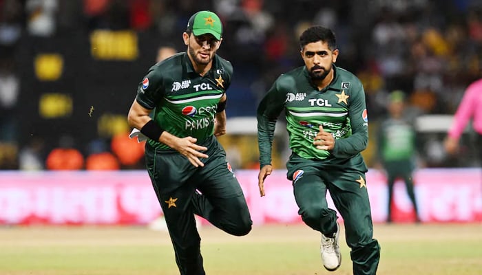 Pakistani cricketers Shaheen Afridi (left) and Babar Azam in action during a match in this undated image. — AFP/File