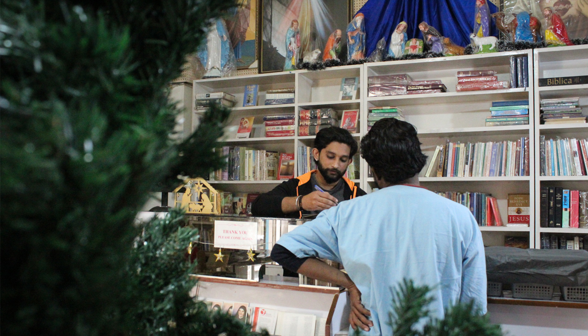 Astel Vishal attends to a customer at the till. — Photo by author