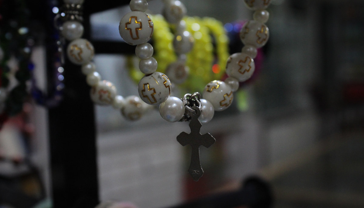 A photograph of a mini rosary available for sale at the store. — Photo by author