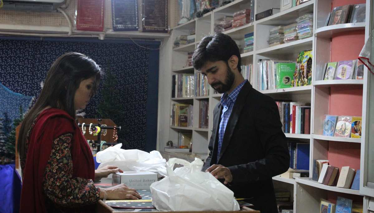 Jerome John attends to a customer at the store. — Photo by author