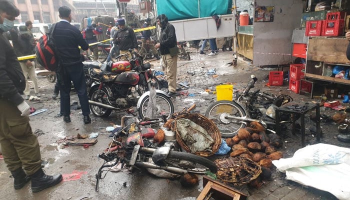 Burnt motorcycles are seen in Anarkali Bazaar, Lahore, where an explosion occurred, on January 20, 2022. — X