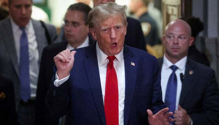 Former US president Donald Trump gestures while leaving the courtroom during a break, as he attends the Trump Organization civil fraud trial, in New York State Supreme Court in the Manhattan borough of New York City, US, December 7, 2023. — Reuters