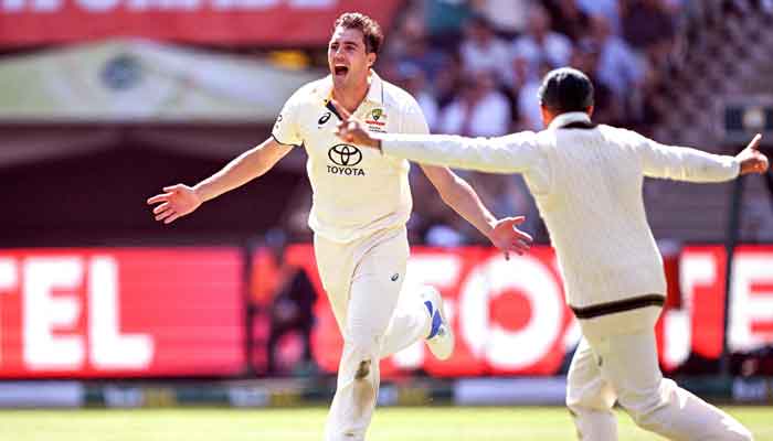 Pat Cummins celebrates dismissing Barbar Azam on the second day of the second cricket Test match between Australia and Pakistan at the Melbourne Cricket Ground (MCG) in Melbourne on December 27, 2023. —AFP