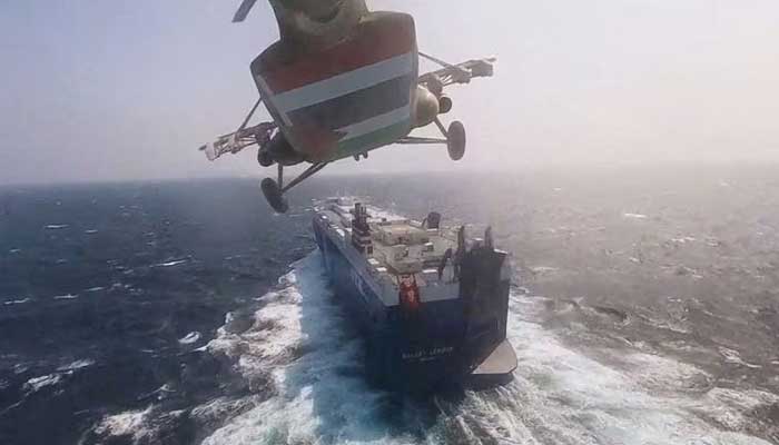 Houthi military helicopter flies over the Galaxy Leader cargo ship in the Red Sea in this photo released November 20, 2023. — Reuters