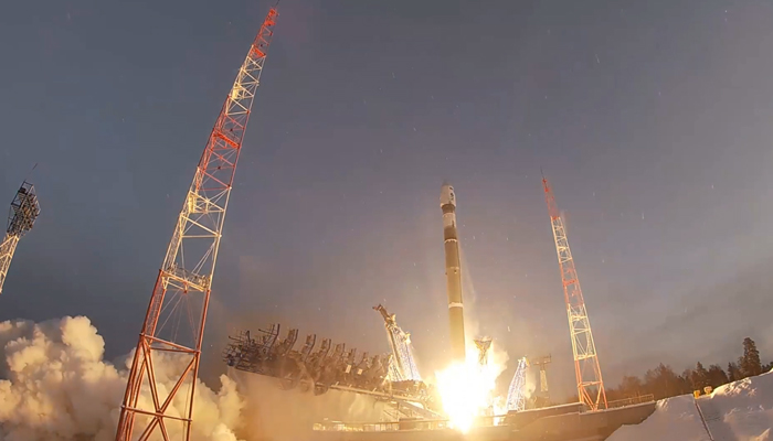 This frame grab taken from a video released on December 27, 2023, shows a light-class Soyuz-2.1b rocket blasting off in the Arkhangelsk region (Plesetsk) carrying a new military satellite. — Russian defence ministry