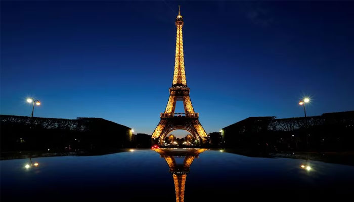 A night view shows the Eiffel tower, reflected in a cars roof, in Paris, France, April 30, 2016. — Reuters