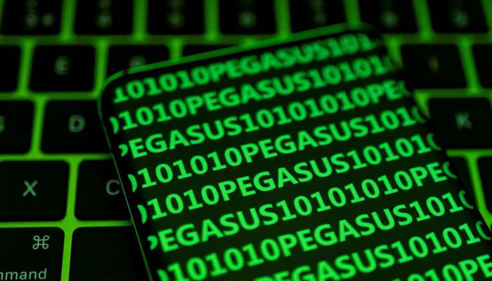 The word Pegasus and binary code are displayed on a smartphone which is placed on a keyboard in this illustration taken May 4, 2022. — Reuters