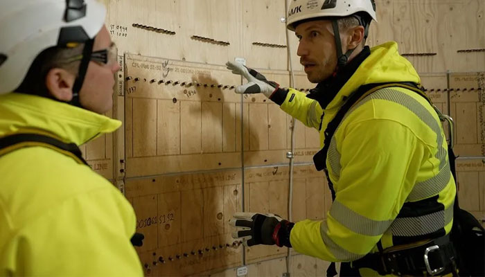 Otto Lundman of Modvion shows Jonah the interior of the wooden turbine.—Modvion