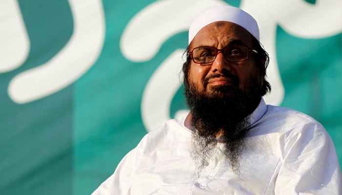 Hafiz Muhammad Saeed, chief of banned banned Jamaatud Dawa, looks over the crowd at a protest in Islamabad, on July 20, 2016. — Reuters