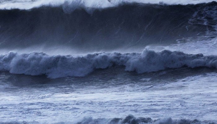 The image shows massive waves pounding the central California coast. — Reuters