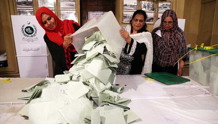 Election officials count ballots after polls closed during the general election in Islamabad, Pakistan, on July 25, 2018. — Reuters