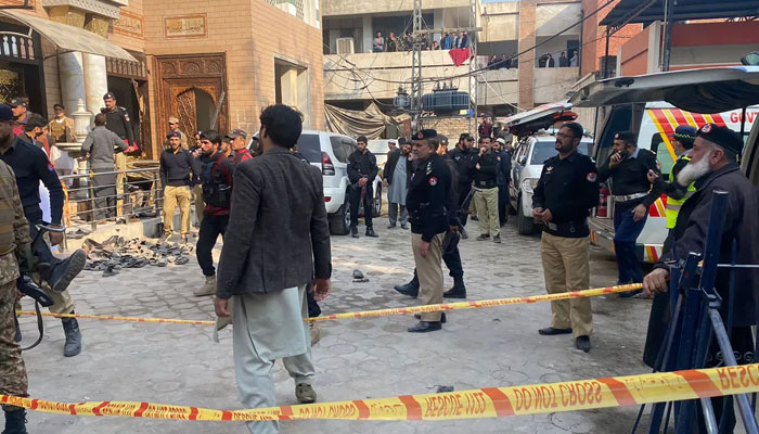 Security personnel cordon off the site of a mosque blast inside the provincial police headquarters in Peshawar on January 30, 2023. — AFP