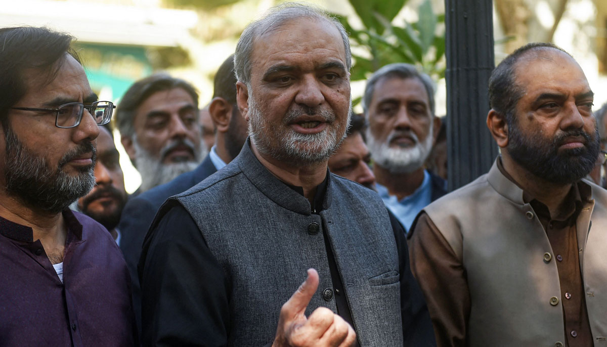 Hafiz Naeem Ur Rehman (C), Karachi Chief of Islamist party Jamaat-e-Islami (JI) speaks to the media after submitting nomination papers at the deputy commissioner office in Karachi on December 22, 2023, ahead of the upcoming 2024 general elections. — AFP
