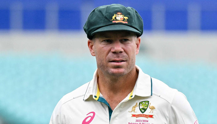 Australia’s David Warner looks on before a team photo ahead of the third Test match between Australia and Pakistan at the Sydney Cricket Ground in Sydney on January 1, 2024. — AFP