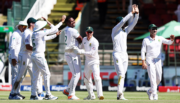 Cricket - Second Test - South Africa v India - Newlands Cricket Ground, Cape Town, South Africa - January 3, 2024 South Africas Lungi Ngidi celebrates with teammates after taking the wicket of Indias Jasprit Bumrah, caught out by Marco Jansen. — Reuters