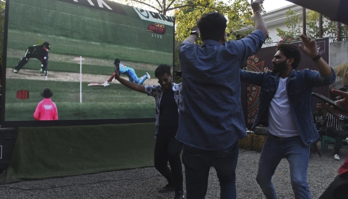Fans in Lahore celebrate Axar Patel’s run-out in India vs Pakistan T20 World Cup match in MCG on October 23, 2022. —AFP