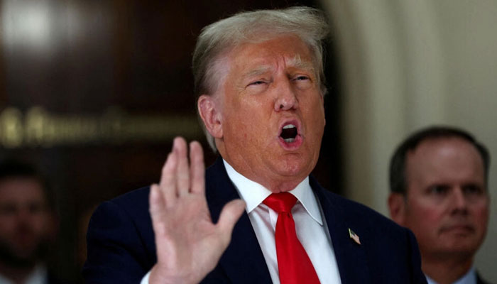 Former US President Donald Trump gestures while talking to the media during a break as he attends trial in a civil fraud case brought by state Attorney General Letitia James against him, his adult sons, the Trump Organization and others in New York City, October 4, 2023. — Reuters