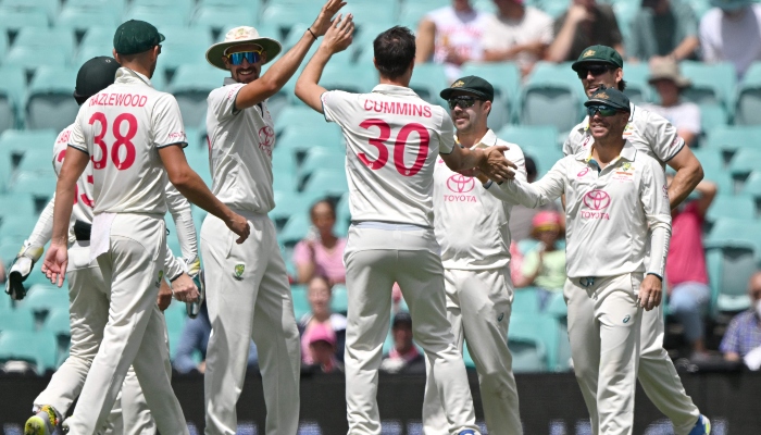 Australia’s Pat Cummins celebrates the wicket of Pakistan’s Aamer Jamal with teammates during day four of the third Test between Australia and Pakistan at the Sydney Cricket Ground on January 6, 2024. —AFP