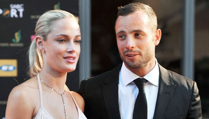 Oscar Pistorius and his girlfriend Reeva Steenkamp in Johannesburg in 2012. —AFP