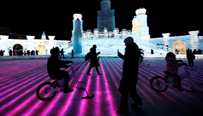 People enjoy themselves at the Harbin International Ice and Snow Festival, in Harbin, Heilongjiang province, China. — Reuters