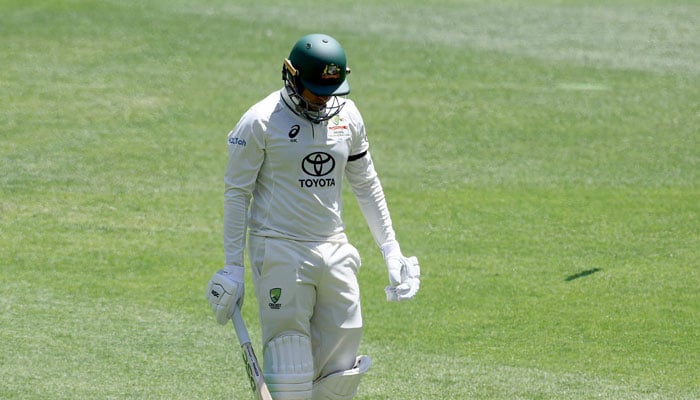 Australias Usman Khawaja walks off the field during the first day of the first Test cricket match between Australia and Pakistan at Optus Stadium in Perth on December 14, 2023. — AFP