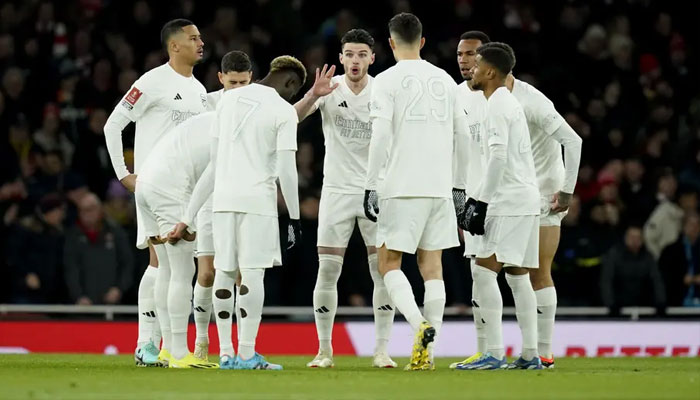 Arsenal wore an all-white kit against Liverpool.—AFP