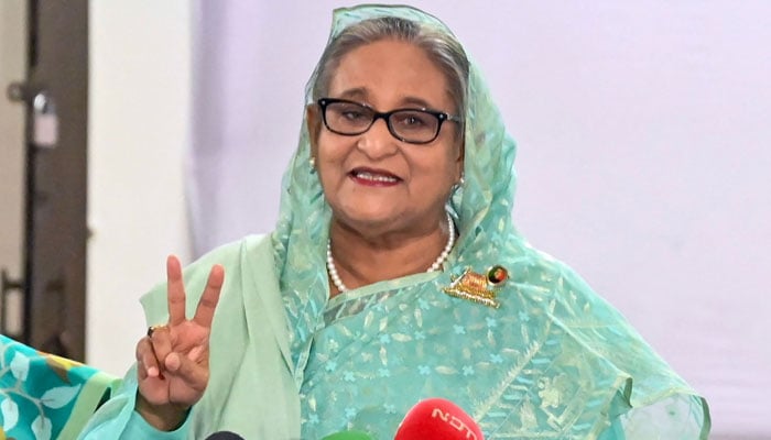 Bangladeshs Prime Minister Sheikh Hasina gestures after casting her vote casts at a polling station in Dhaka on January 7, 2024. — AFP